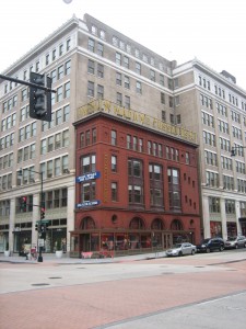 Little building next to big building