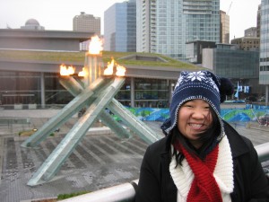 Angela in front of the Olympic torch